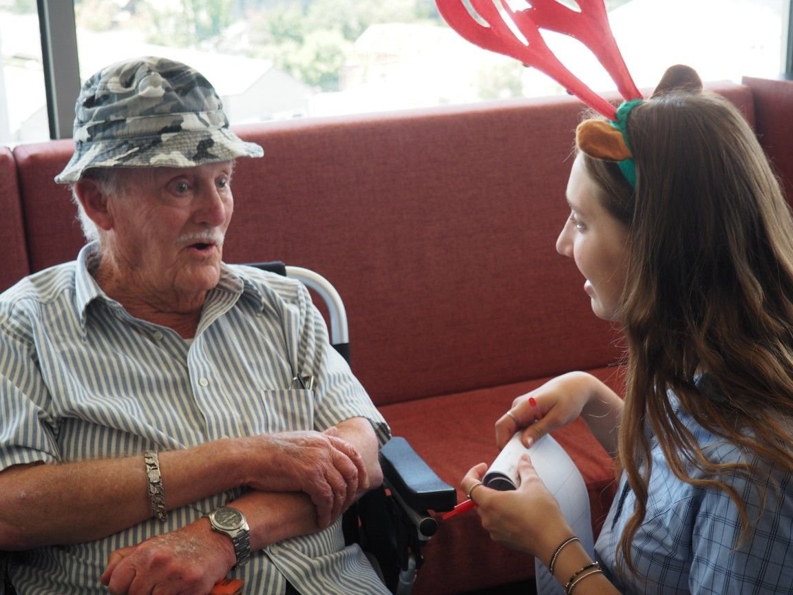 A volunteer visiting a senior man