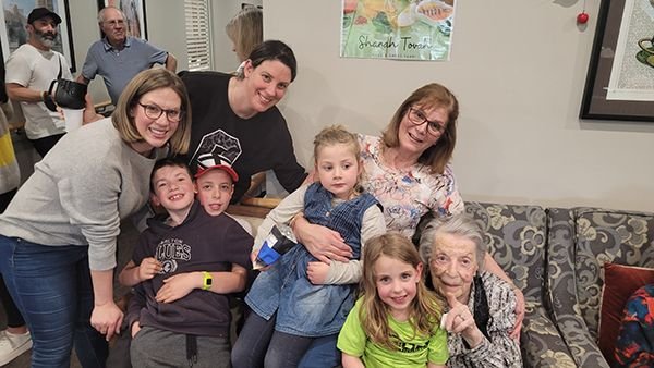 Families and seniors gathered at a Smiles Hub afternoon