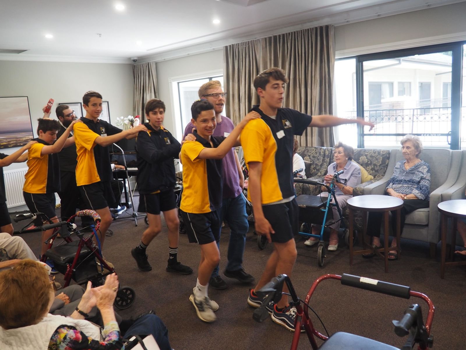 Students spending time with a senior resident