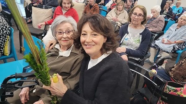 Seniors celebrating together in a succah